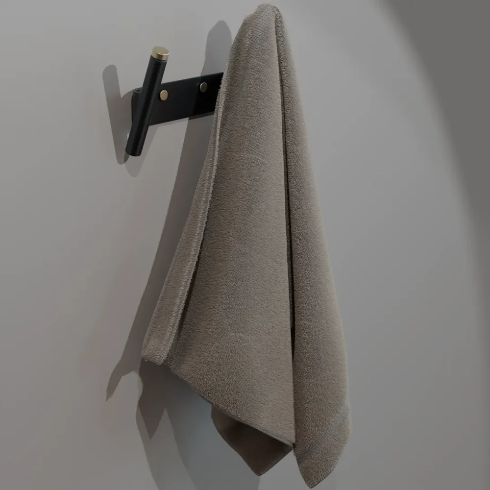 Sleek, Matte Black Towel Hook With Brass Accents, Perfect For Modern Bathroom Or Kitchen Interiors