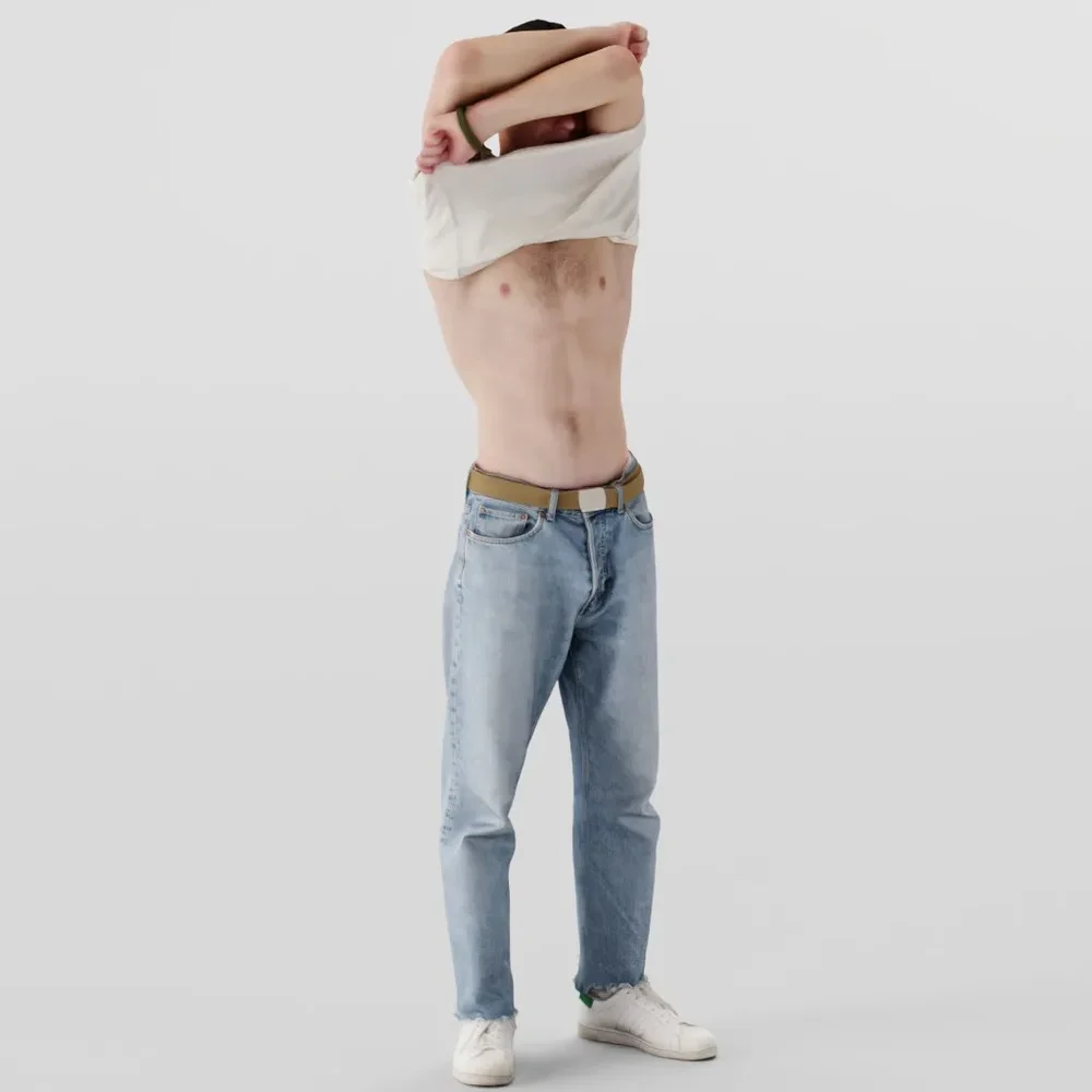 Guy Takes Off His Shirt