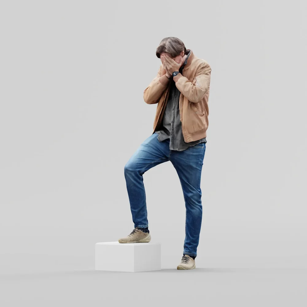 Guy Covers His Face With His Palms