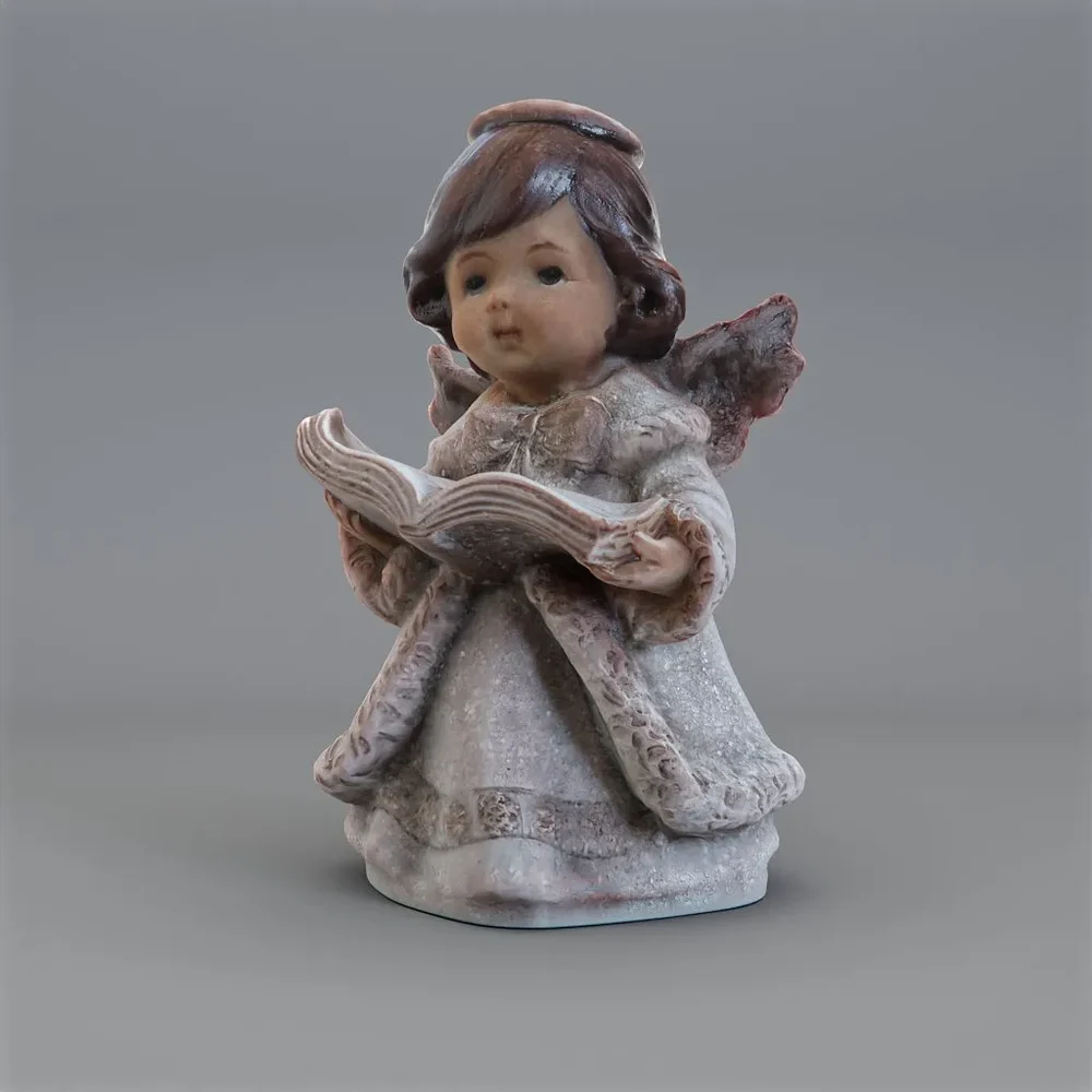 Statuette Of Angel With Book