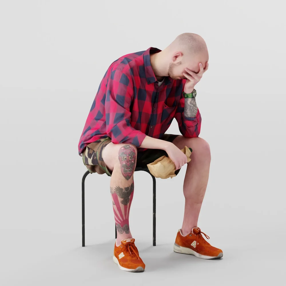 Disappointed Bald Guy Sits