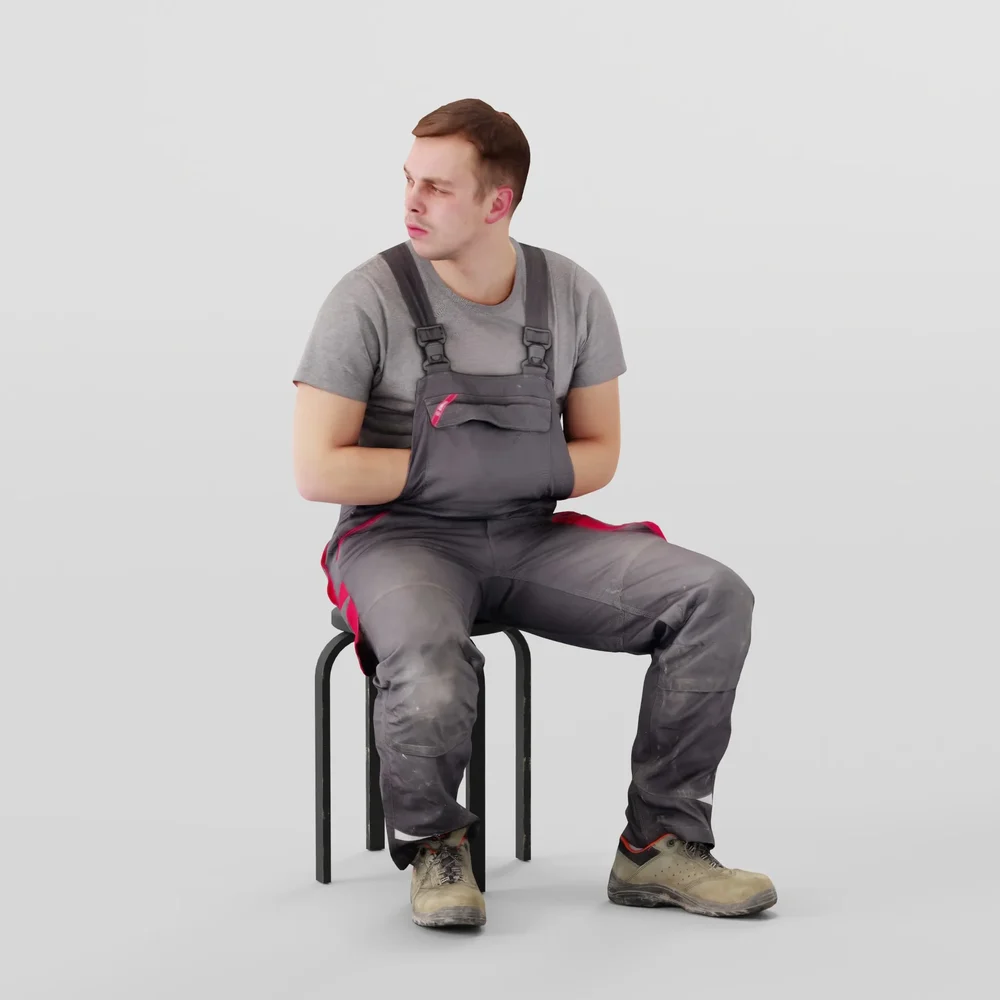 Foreman In Overalls Sitting